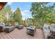 Relaxing outdoor deck area with comfortable seating, perfect for enjoying the views at 80 Spruce Ct, Evergreen, CO 80439