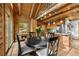 Inviting dining area features wood floors and an adjacent modern kitchen at 80 Spruce Ct, Evergreen, CO 80439