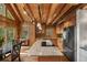 Open concept kitchen featuring stainless appliances, granite counters, and an island cooktop at 80 Spruce Ct, Evergreen, CO 80439