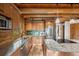 Bright kitchen with wooden ceiling, stainless steel appliances, granite countertops, and views of the outdoors at 80 Spruce Ct, Evergreen, CO 80439