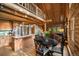Open concept living space featuring a kitchen island, dining area, and upstairs loft at 80 Spruce Ct, Evergreen, CO 80439