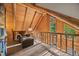 Loft seating area with vaulted ceilings, perfect for reading or relaxing at 80 Spruce Ct, Evergreen, CO 80439