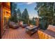 Relaxing outdoor deck features comfortable seating and scenic views of the surrounding landscape at 80 Spruce Ct, Evergreen, CO 80439