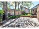 Backyard brick patio, wooden fence and lush green landscaping at 766 Monroe St, Denver, CO 80206