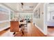 Open dining room with hardwood floors, modern light fixture, and seamless flow to other living spaces at 766 Monroe St, Denver, CO 80206