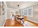 Elegant dining room featuring hardwood floors, modern light fixtures, and ample natural light at 766 Monroe St, Denver, CO 80206