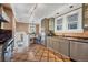 Stylish kitchen featuring stainless steel appliances, unique flooring, and cozy breakfast nook at 766 Monroe St, Denver, CO 80206