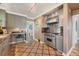 Modern kitchen featuring stainless steel appliances, designer flooring, and convenient layout at 766 Monroe St, Denver, CO 80206