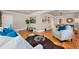 Cozy living room featuring hardwood floors, stylish decor, and seamless flow into dining area at 766 Monroe St, Denver, CO 80206