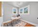 Small office space featuring two large windows and stylish decor at 766 Monroe St, Denver, CO 80206