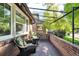 Cozy outdoor porch with comfortable seating and brick accents at 766 Monroe St, Denver, CO 80206