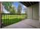 View from the balcony with green space and a mature tree at 4899 S Dudley St # 7E, Littleton, CO 80123