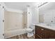 A clean bathroom with a shower and bathtub combination at 4899 S Dudley St # 7E, Littleton, CO 80123