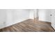 Spacious bedroom showcasing sleek wooden flooring, white walls, and bright natural light at 4899 S Dudley St # 7E, Littleton, CO 80123