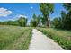 Picturesque walking path surrounded by lush greenery, creating a serene outdoor experience at 4899 S Dudley St # 7E, Littleton, CO 80123