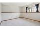 Bright bedroom with a window and neutral carpet at 9655 W 105Th Way, Broomfield, CO 80021