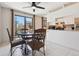 Cozy dining area adjacent to a modern kitchen, featuring a sliding glass door to a balcony at 9655 W 105Th Way, Broomfield, CO 80021