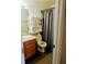 Cozy bathroom featuring wood-look floors, a classic toilet, and a vanity with cabinet storage at 4395 S Gibraltar St, Centennial, CO 80015