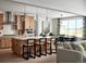 Bright, open kitchen with a large island, modern appliances, and a connected dining area at 5726 Margarita Pt, Parker, CO 80134