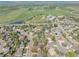 This home offers proximity to a school and sports field, as seen in the aerial view of the neighborhood at 128 Baylor Dr, Longmont, CO 80503