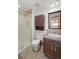 Cozy bathroom with updated vanity, tiled floors, and a glass enclosed shower at 128 Baylor Dr, Longmont, CO 80503