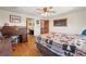 Spacious bedroom features hardwood floors and a view into the en-suite bathroom at 128 Baylor Dr, Longmont, CO 80503