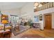 Spacious living room with high ceilings, hardwood floors, and bright natural light at 128 Baylor Dr, Longmont, CO 80503
