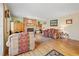 Cozy living room features a brick fireplace and natural wood floors at 128 Baylor Dr, Longmont, CO 80503