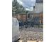Backyard featuring an outdoor seating area with chairs, table, and rock landscaping at 9610 W Chatfield Ave # F, Littleton, CO 80128