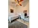 Cozy bedroom featuring a ceiling fan and a comfortable workspace with natural light at 9610 W Chatfield Ave # F, Littleton, CO 80128