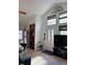 Bright entryway with high ceilings, a modern washer/dryer, and large windows at 9610 W Chatfield Ave # F, Littleton, CO 80128