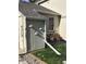 Exterior shot of the house showcasing the roofline, and a bike parked on the patio at 9610 W Chatfield Ave # F, Littleton, CO 80128