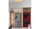 Contemporary kitchen with stainless steel refrigerator and unique red washer/dryer at 9610 W Chatfield Ave # F, Littleton, CO 80128