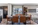 Dining area with modern table and chairs, adjacent to kitchen at 12387 W 51St Ave, Wheat Ridge, CO 80033