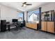 Bright home office features built-in shelving and large windows at 12387 W 51St Ave, Wheat Ridge, CO 80033