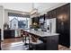 Modern kitchen with granite countertops, stainless steel appliances, and an island at 12387 W 51St Ave, Wheat Ridge, CO 80033