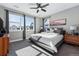 Spacious main bedroom with large windows, ceiling fan, and modern decor at 12387 W 51St Ave, Wheat Ridge, CO 80033