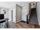 Modern staircase with dark wood railing and carpet steps at 12387 W 51St Ave, Wheat Ridge, CO 80033