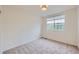 Bedroom featuring a large window with plenty of natural light at 176 S Rosemary St, Denver, CO 80230