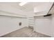 Walk-in closet with custom shelving and hanging rods, offering ample storage space at 176 S Rosemary St, Denver, CO 80230