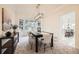Elegant dining room with modern light fixture, bay window, and stylish décor, ideal for hosting dinner parties at 176 S Rosemary St, Denver, CO 80230