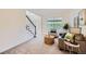 Inviting living room with comfortable seating and natural light, next to the staircase at 176 S Rosemary St, Denver, CO 80230