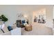 Comfortable living room featuring stylish furniture and decor, adjacent to the dining area at 176 S Rosemary St, Denver, CO 80230