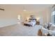 Spacious main bedroom with carpet, featuring a sitting area and ensuite bathroom at 176 S Rosemary St, Denver, CO 80230