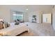 Large carpeted main bedroom with a seating area near the window, offering ample natural light at 176 S Rosemary St, Denver, CO 80230