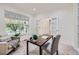 Bright home office with natural light, neutral décor, and a comfortable workspace, perfect for remote work at 176 S Rosemary St, Denver, CO 80230