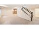 Carpeted staircase leading to the finished basement at 176 S Rosemary St, Denver, CO 80230