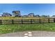 Backyard view of fenced community homes on a sunny day at 39167 Braxton Ln, Elizabeth, CO 80107
