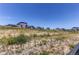 View of several homes in the community from the undeveloped backyard at 39167 Braxton Ln, Elizabeth, CO 80107