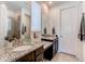 Bathroom featuring granite countertops, dual sinks, modern fixtures, and tiled floors at 39167 Braxton Ln, Elizabeth, CO 80107